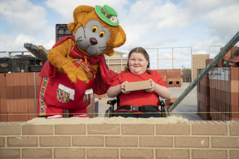 Helpers with the bricklaying